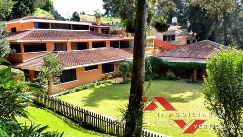 Vendo exclusiva casa km. 18.5 C. Salvador, 1,200m2 Construccoin
