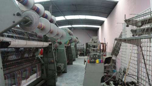 Vendo terreno con galpon en la panamericana norte de Otavalo